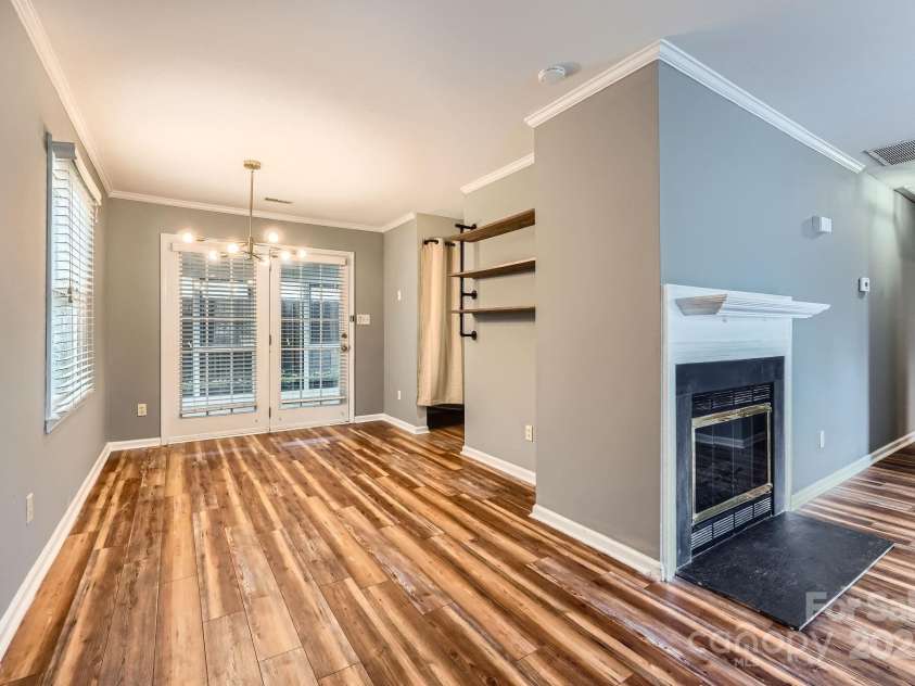 5913 Crape Myrtle Lane, Charlotte, NC 28216.  MLS# CAR4241207, YatesRealty ID 14647. Dining area leads to covered porch.