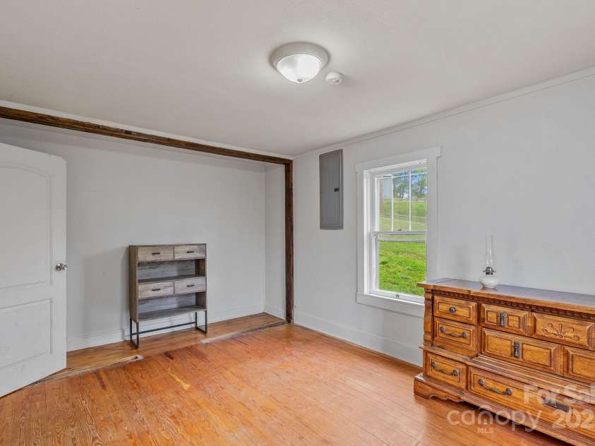 82 Lincoln Park Road, Burnsville, NC 28714.  MLS# CAR4253950, YatesRealty ID 14656. Missing Oak Planks Being Replaced