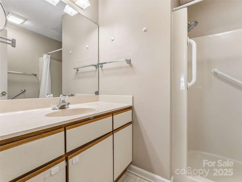 1203 Abbey Circle, Asheville, NC 28805.  MLS# CAR4315432, YatesRealty ID 14657. En-suite main bathroom features walk-in shower