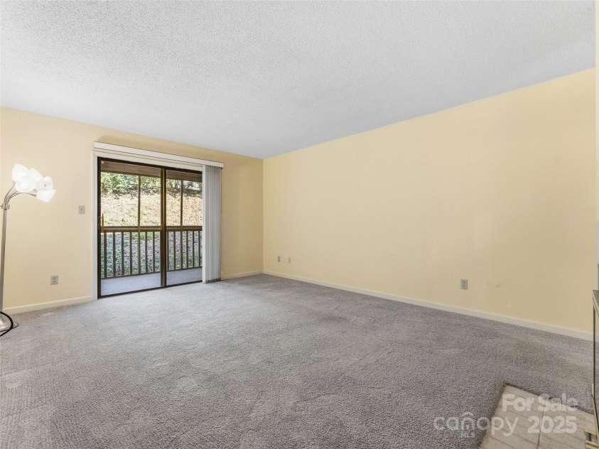 1203 Abbey Circle, Asheville, NC 28805.  MLS# CAR4315432, YatesRealty ID 14657. Spacious living room
