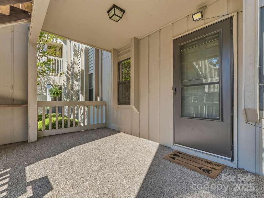 1203 Abbey Circle, Asheville, NC 28805.  MLS# CAR4315432, YatesRealty ID 14657. Spacious, sunny front porch.