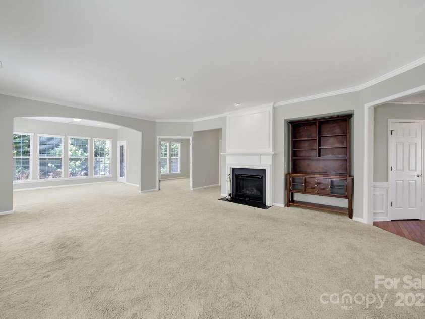 8107 Crater Lake Drive, Indian Land, SC 29707.  MLS# CAR4233120, YatesRealty ID 14662. Great room with gas log fireplace & entertainment nook.