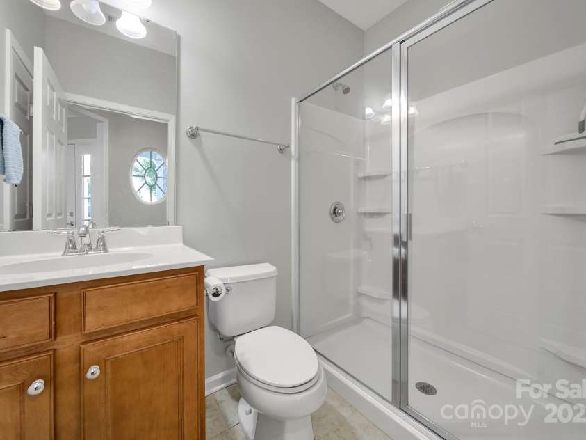 8107 Crater Lake Drive, Indian Land, SC 29707.  MLS# CAR4233120, YatesRealty ID 14662. Guest bathroom with oversized walk-in shower.