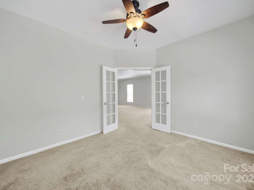8107 Crater Lake Drive, Indian Land, SC 29707.  MLS# CAR4233120, YatesRealty ID 14662. Office with glassed French doors open to great room.