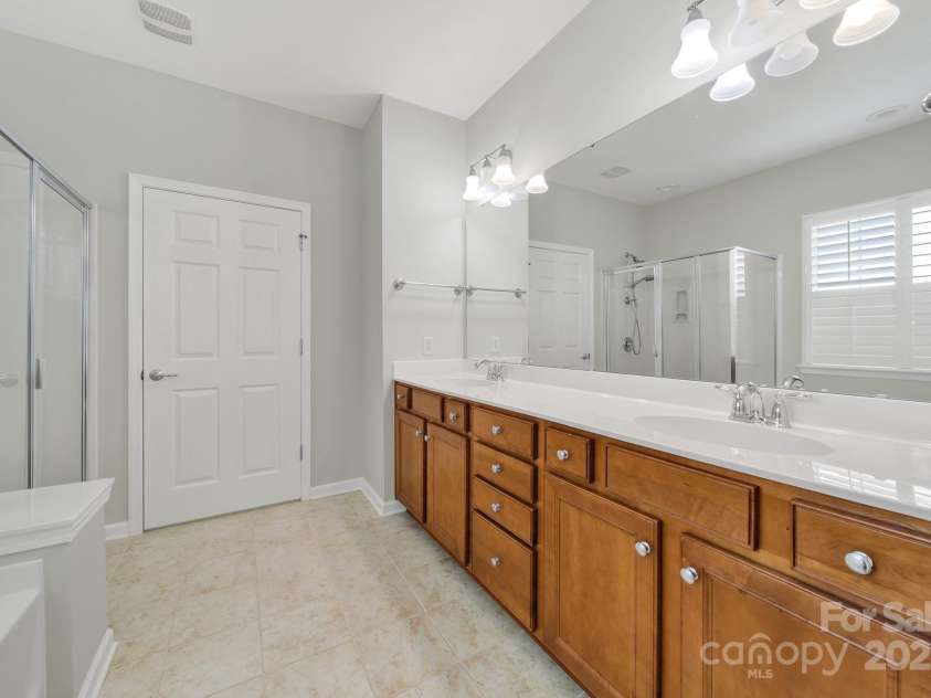 8107 Crater Lake Drive, Indian Land, SC 29707.  MLS# CAR4233120, YatesRealty ID 14662. Primary bath - dual sinks, walk-in closet and separate water closet.