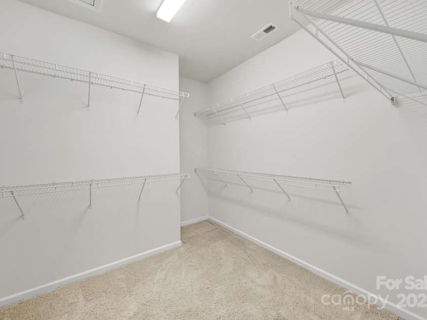 8107 Crater Lake Drive, Indian Land, SC 29707.  MLS# CAR4233120, YatesRealty ID 14662. Primary Bedroom walk-in closet.