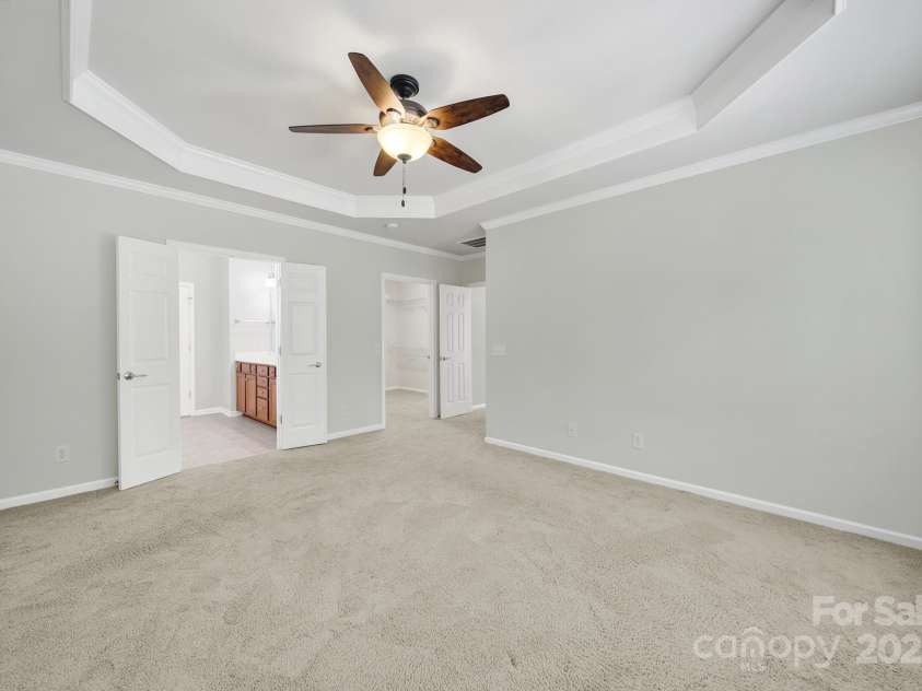 8107 Crater Lake Drive, Indian Land, SC 29707.  MLS# CAR4233120, YatesRealty ID 14662. Primary bedroom with tray ceiling.