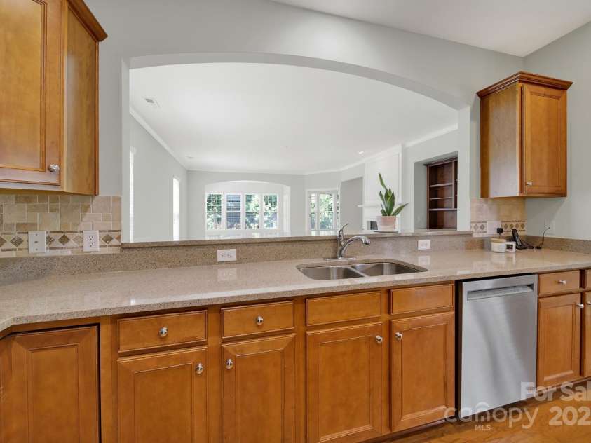8107 Crater Lake Drive, Indian Land, SC 29707.  MLS# CAR4233120, YatesRealty ID 14662. Sunny pass through window into great room.