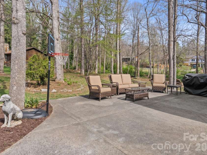 29 Muirfield Drive, Arden, NC 28704.  MLS# CAR4364187, YatesRealty ID 14672. Side Patio off Garage