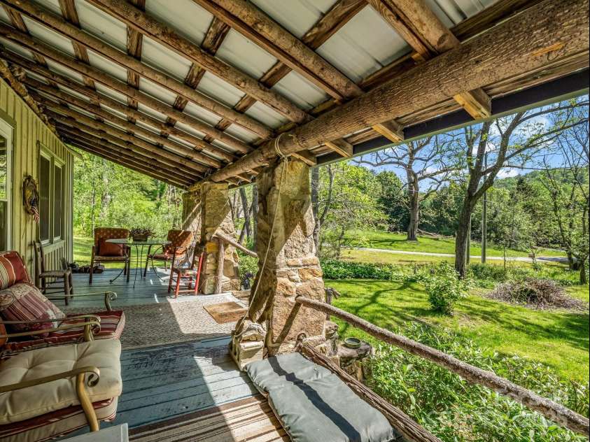 51 Moffitt Road, Horse Shoe, NC 28742.  MLS# CAR4257739, YatesRealty ID 14674. Covered front porch