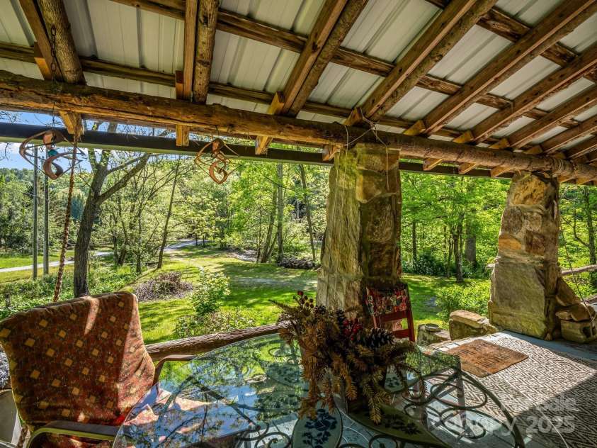51 Moffitt Road, Horse Shoe, NC 28742.  MLS# CAR4257739, YatesRealty ID 14674. Covered front porch