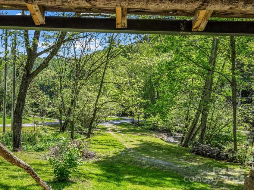 51 Moffitt Road, Horse Shoe, NC 28742.  MLS# CAR4257739, YatesRealty ID 14674. View from front porch