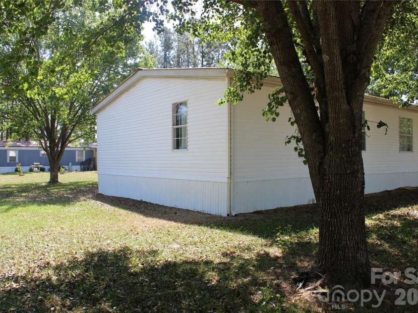 249 J L Green Lane, Pageland, SC 29728.  MLS# CAR4373064, YatesRealty ID 14676. Back corner