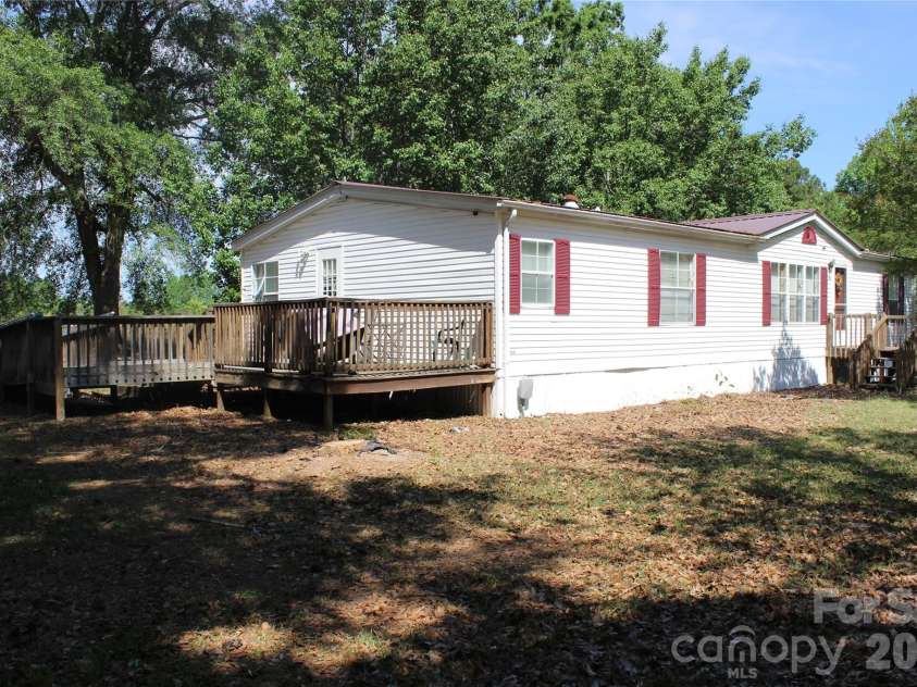 249 J L Green Lane, Pageland, SC 29728.  MLS# CAR4373064, YatesRealty ID 14676. Front corner with view of side deck