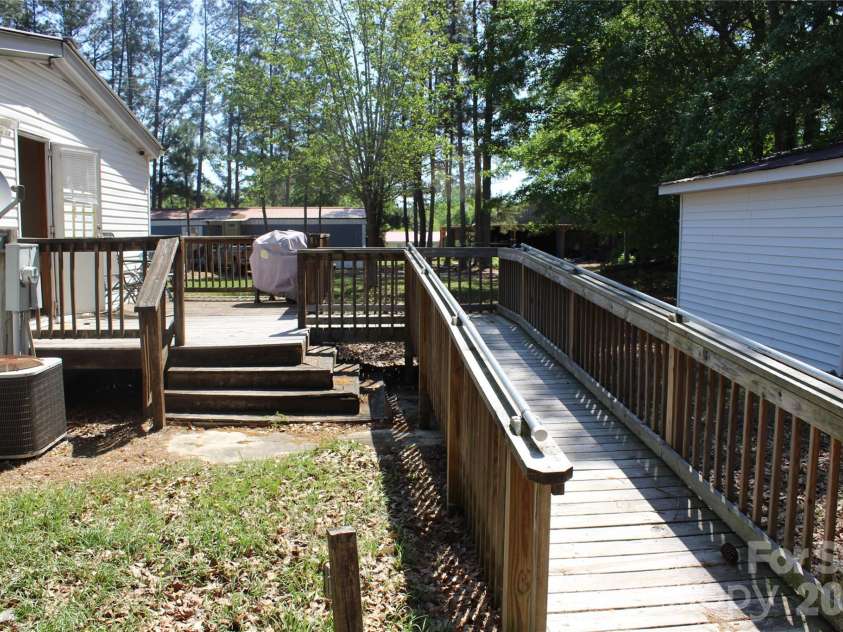 249 J L Green Lane, Pageland, SC 29728.  MLS# CAR4373064, YatesRealty ID 14676. Ramp and side deck