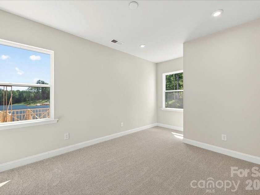 183 Landy Street, Fort Mill, SC 29715.  MLS# CAR4360547, YatesRealty ID 14679. Light filled secondary bedroom
