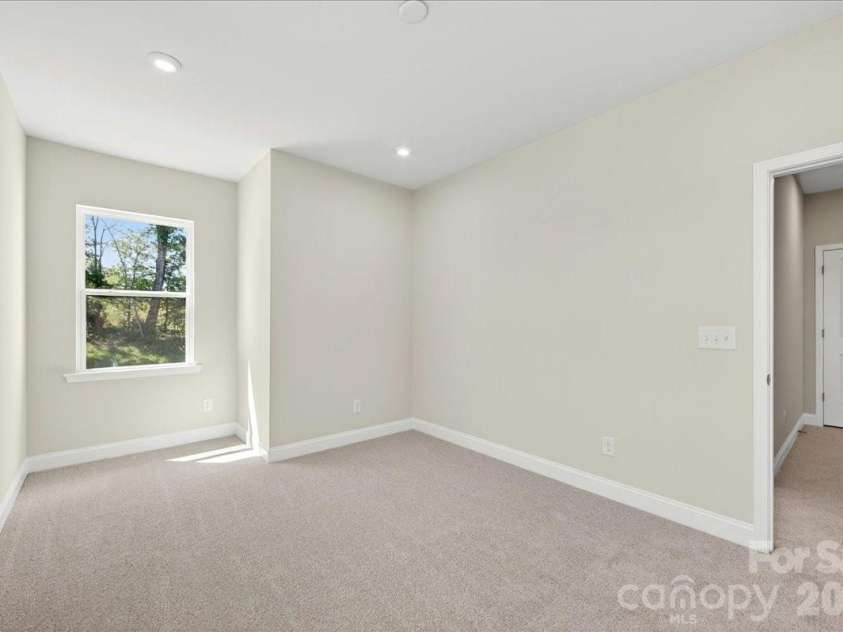 183 Landy Street, Fort Mill, SC 29715.  MLS# CAR4360547, YatesRealty ID 14679. Light filled secondary bedroom