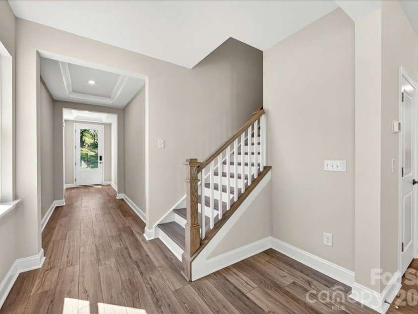 183 Landy Street, Fort Mill, SC 29715.  MLS# CAR4360547, YatesRealty ID 14679. Oak box stairs with open rails