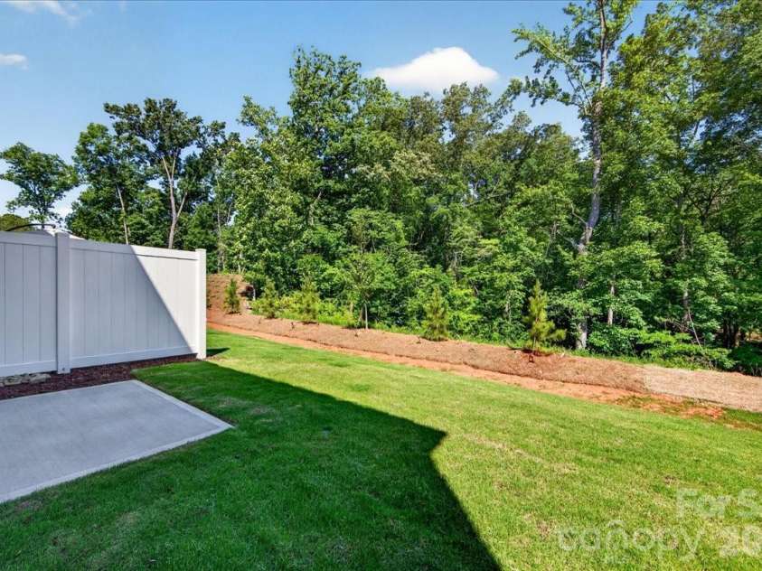 183 Landy Street, Fort Mill, SC 29715.  MLS# CAR4360547, YatesRealty ID 14679. Outdoor living space with tree-lined views