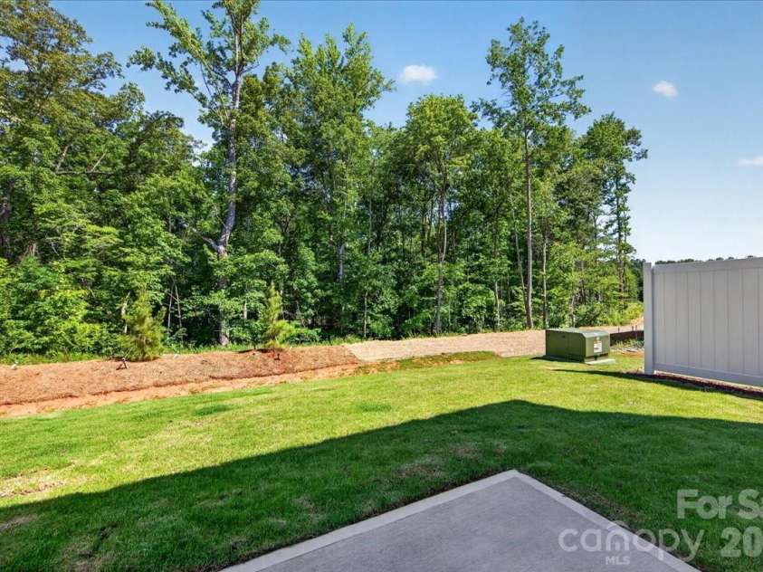 183 Landy Street, Fort Mill, SC 29715.  MLS# CAR4360547, YatesRealty ID 14679. Outdoor living space with tree-lined views