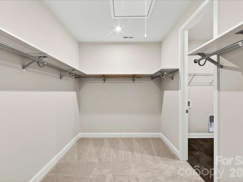 183 Landy Street, Fort Mill, SC 29715.  MLS# CAR4360547, YatesRealty ID 14679. Primary Walk-in closet with upgraded shelving and access to the laundry room
