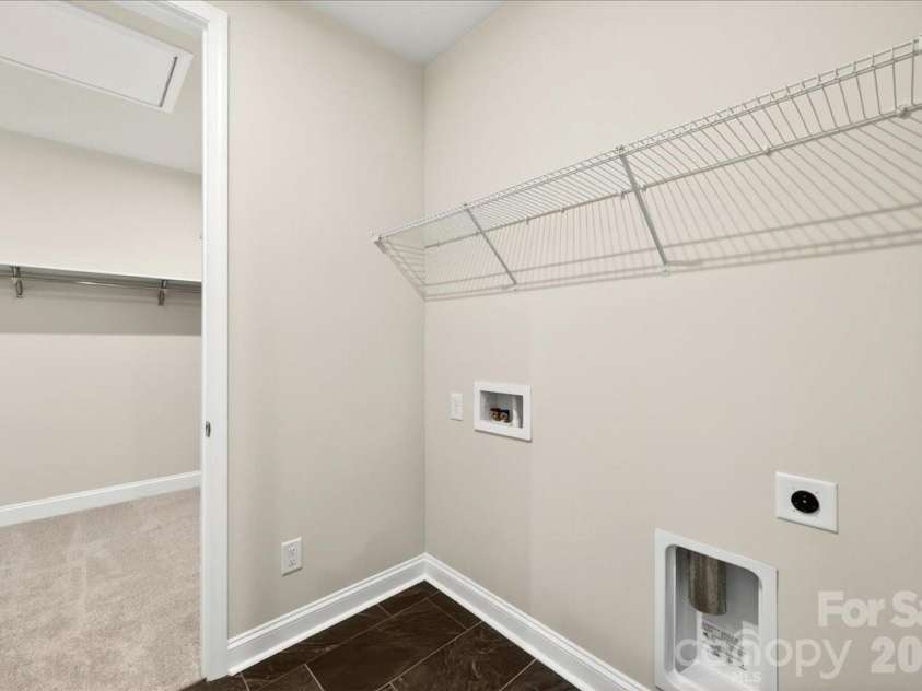 183 Landy Street, Fort Mill, SC 29715.  MLS# CAR4360547, YatesRealty ID 14679. Tiled laundry room