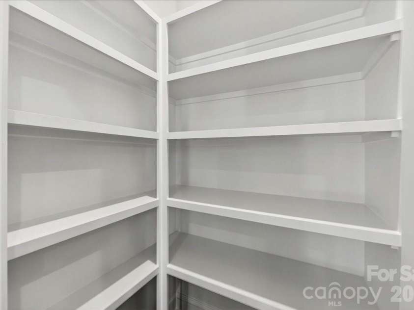 183 Landy Street, Fort Mill, SC 29715.  MLS# CAR4360547, YatesRealty ID 14679. Upgraded kitchen pantry with built-in shelving