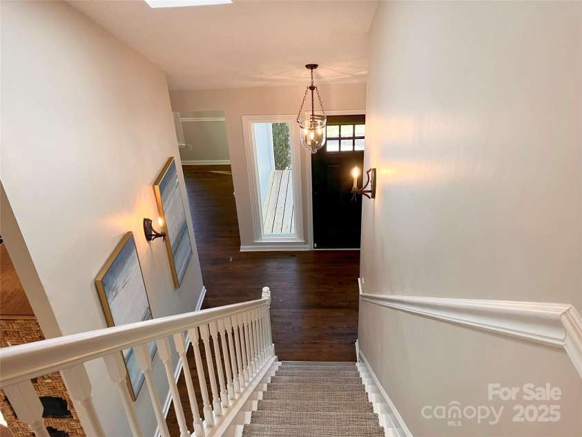 23 Moriah Lane, Asheville, NC 28803.  MLS# CAR4221443, YatesRealty ID 1468. Stairs from entryway leading up to second story.