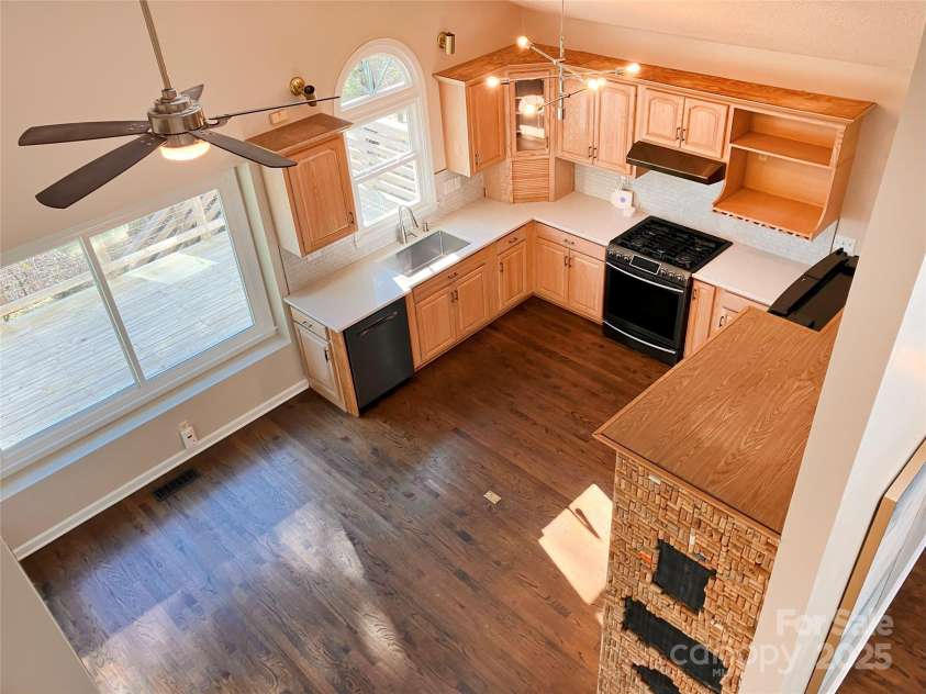 23 Moriah Lane, Asheville, NC 28803.  MLS# CAR4221443, YatesRealty ID 1468. View of kitchen from open second-story level.