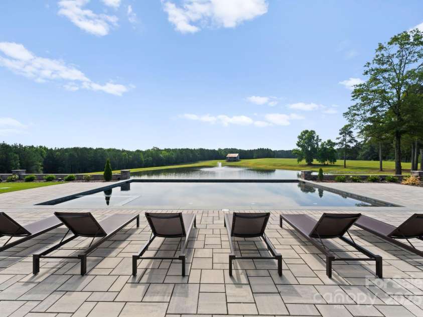 3759 NC 24/27 Highway, Cameron, NC 28326.  MLS# CAR4277323, YatesRealty ID 147. Pool With View Of Lake