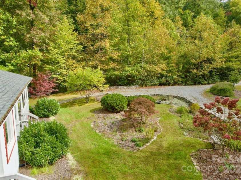 5580 Greenville Highway, Brevard, NC 28712.  MLS# CAR4196657, YatesRealty ID 147. Beautiful perennial garden