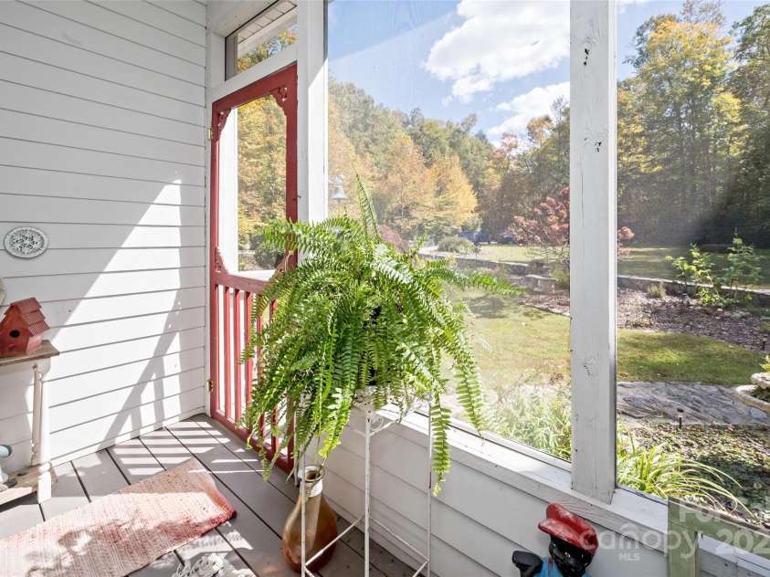 5580 Greenville Highway, Brevard, NC 28712.  MLS# CAR4196657, YatesRealty ID 147. Screen porch off of kitchen