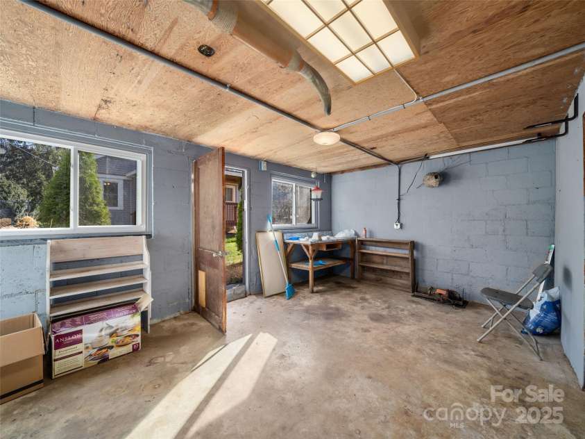 31 Black Branch Road, Canton, NC 28716.  MLS# CAR4208487, YatesRealty ID 14718. Lower level workshop