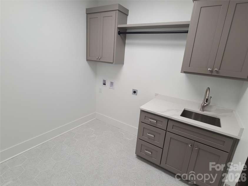 444 19th Avenue Circle, Hickory, NC 28601.  MLS# CAR4187456, YatesRealty ID 14718. Laundry room with sink