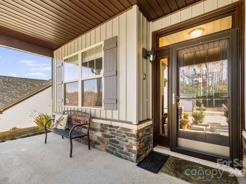 504 Rosebud Orchid Way, Weaverville, NC 28787.  MLS# CAR4318464, YatesRealty ID 14719. Front Porch with Stone accents and a glass door in front of the main door
