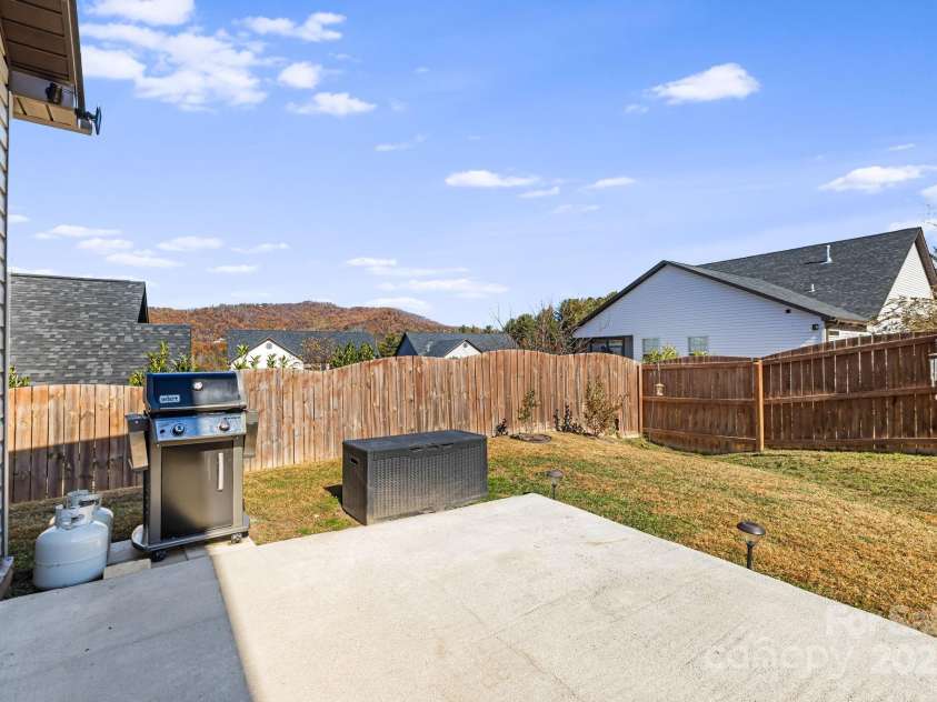504 Rosebud Orchid Way, Weaverville, NC 28787.  MLS# CAR4318464, YatesRealty ID 14719. Patio Fencing for privacy during outdoor BBQ gatherings. Beautiful long range mountain views