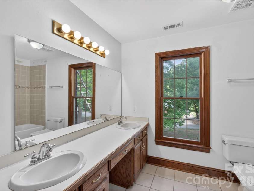 8149 Shannon Woods Lane, Matthews, NC 28104.  MLS# CAR4371130, YatesRealty ID 14728. Shared Bath