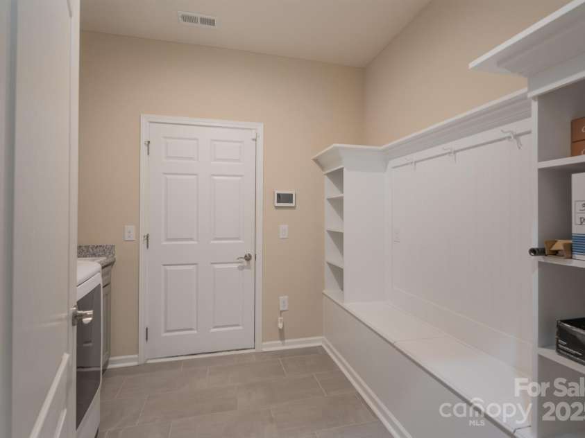 3087 Bartlett Street, Fort Mill, SC 29715.  MLS# CAR4177276, YatesRealty ID 14730. Main Level Laundry Room