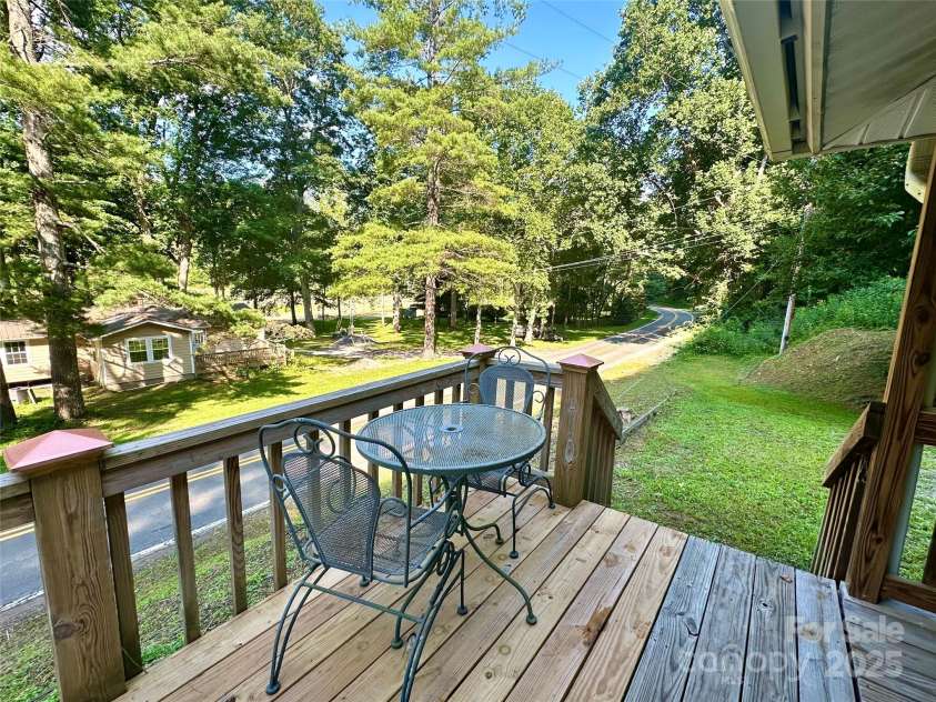 5381 State HWY 197 S Highway, Burnsville, NC 28714.  MLS# CAR4248281, YatesRealty ID 14736. Deck Overlooking River