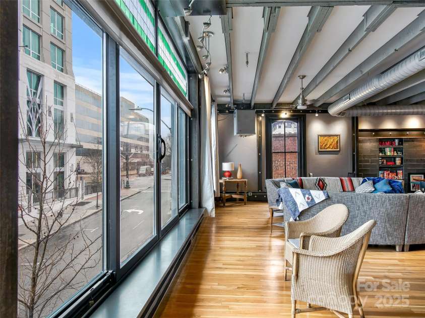 10 Patton Avenue, Asheville, NC 28801.  MLS# CAR4178413, YatesRealty ID 1474. Apartment living area with large windows