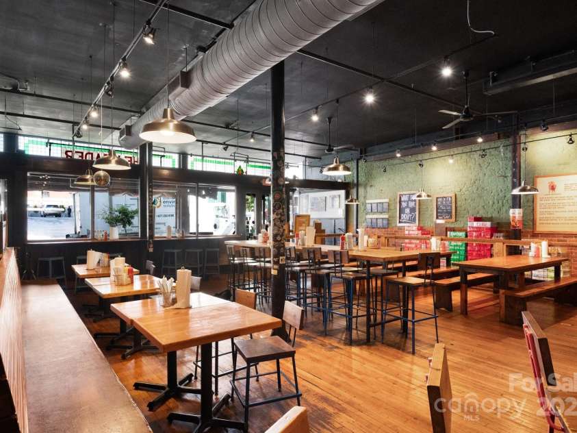 10 Patton Avenue, Asheville, NC 28801.  MLS# CAR4178413, YatesRealty ID 1474. Restaurant dining area with view towards Patton Ave.