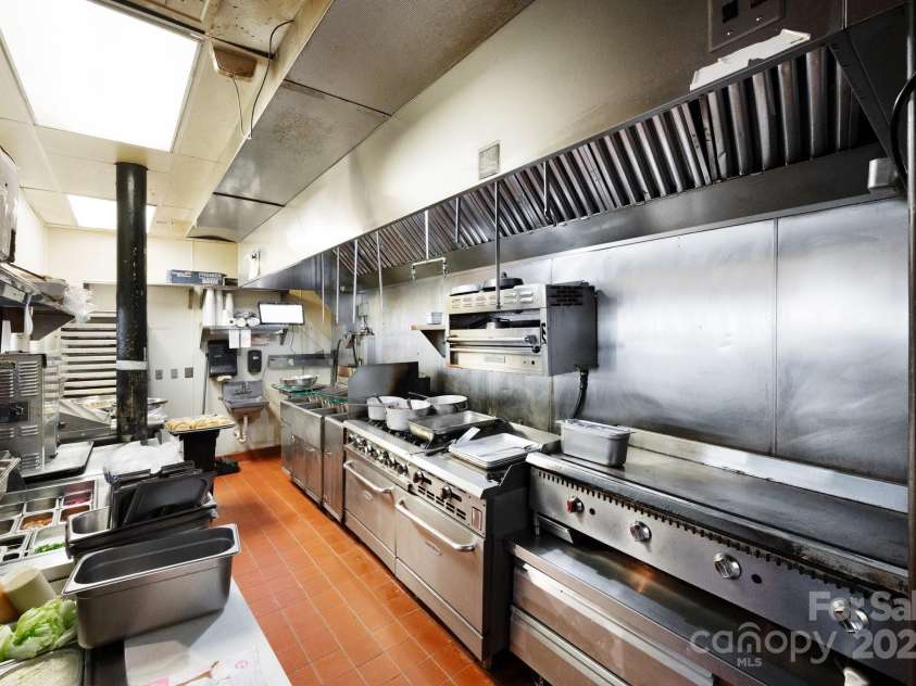 10 Patton Avenue, Asheville, NC 28801.  MLS# CAR4178413, YatesRealty ID 1474. Restaurant kitchen with hood system