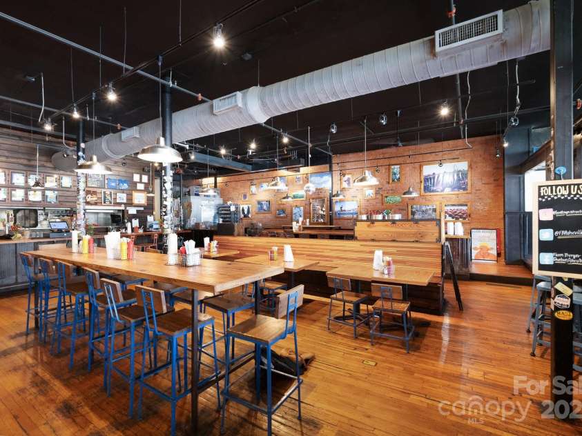 10 Patton Avenue, Asheville, NC 28801.  MLS# CAR4178413, YatesRealty ID 1474. Restaurant spacious dining area with hardwood floors