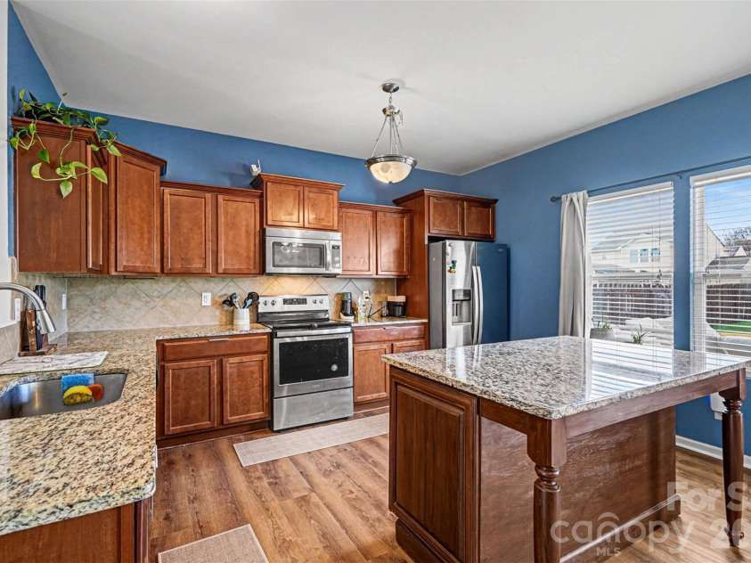 2419 Impatien Drive, Charlotte, NC 28215.  MLS# CAR4355109, YatesRealty ID 14740. Kitchen with island