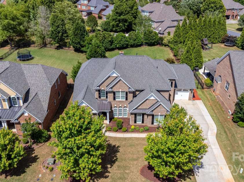 10202 Alouette Drive, Waxhaw, NC 28173.  MLS# CAR4250954, YatesRealty ID 14743. The lush and mature landscaping flanks the home