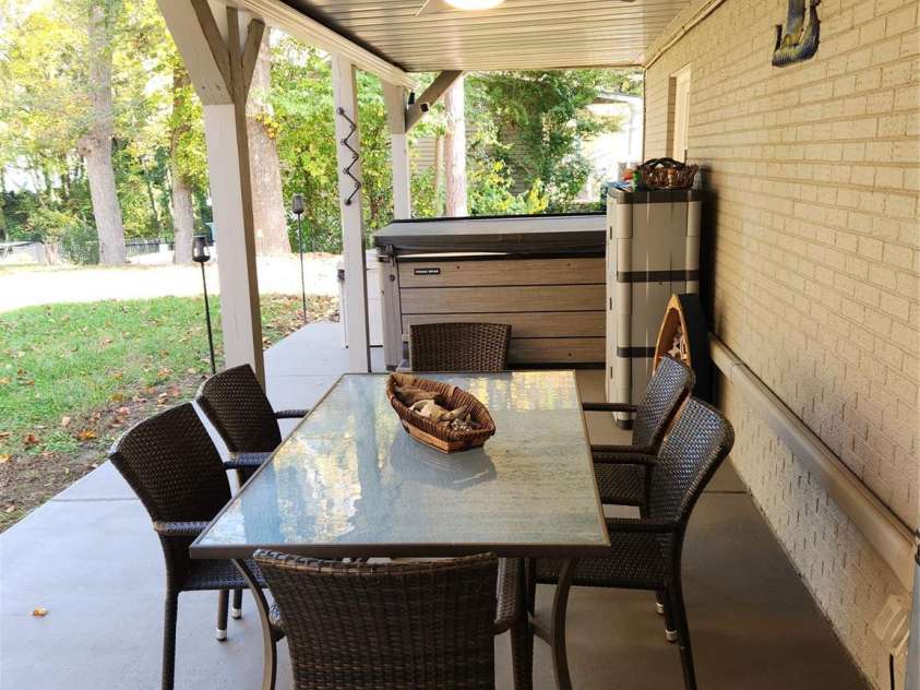 9542 Riviera Drive, Sherrills Ford, NC 28673.  MLS# CAR4298119, YatesRealty ID 14759. Great Place to BBQ - Stay out of the rain and heat ... and end with a relaxing time in the Hot Tub