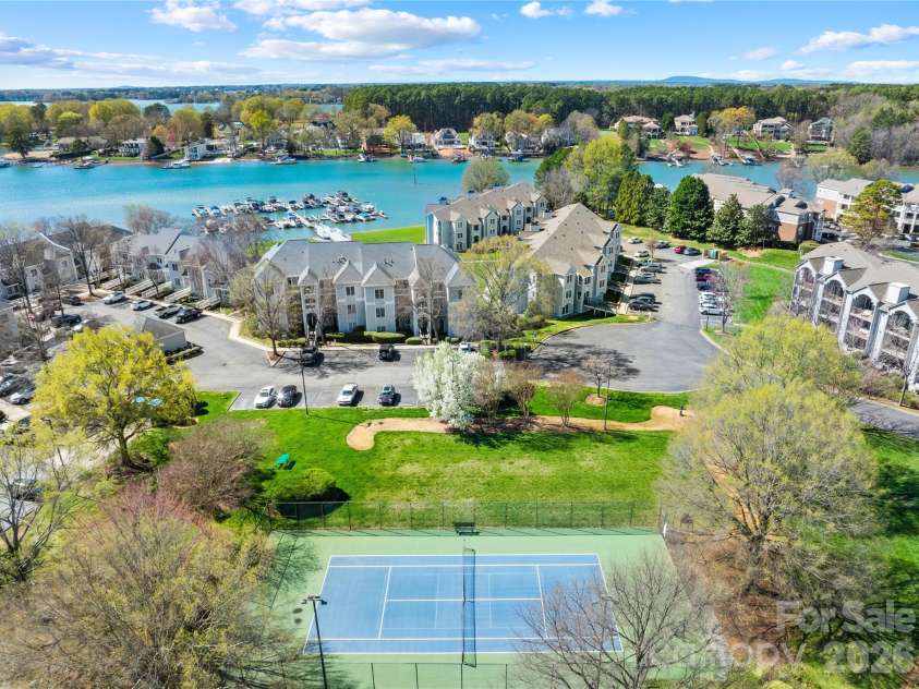18700 Nautical Drive, Cornelius, NC 28031.  MLS# CAR4357308, YatesRealty ID 14763. Admiral's Quarters Tennis/Pickellball Court across from the unit ! 