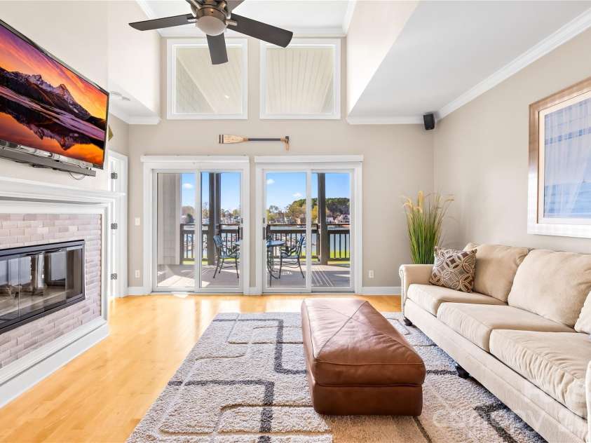 18700 Nautical Drive, Cornelius, NC 28031.  MLS# CAR4357308, YatesRealty ID 14763. Awesome vaulted ceilings - 2 sets of sliding doors leading out to your oversized covered deck. 