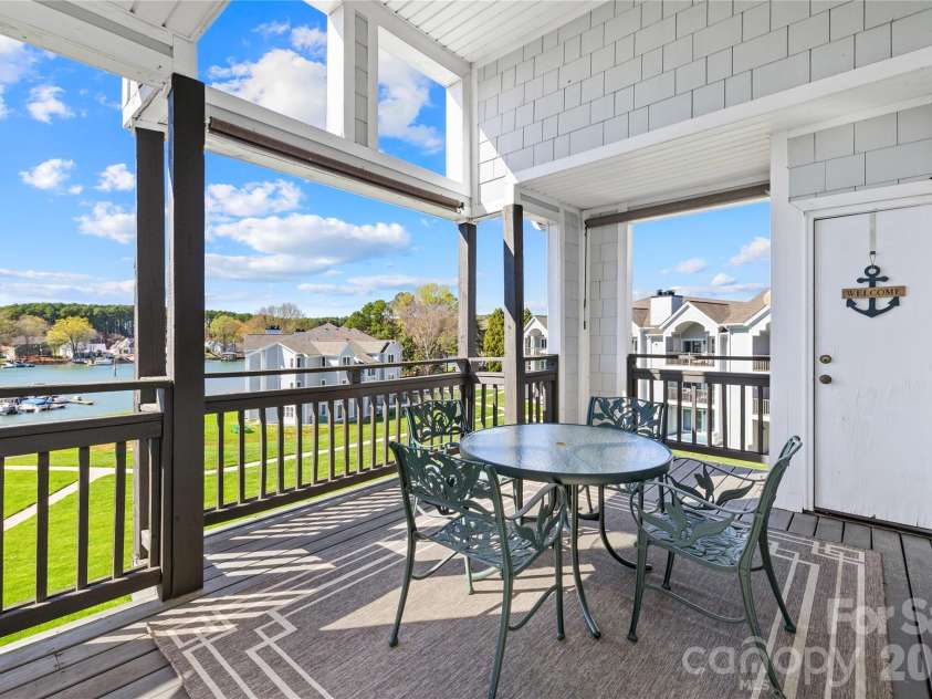 18700 Nautical Drive, Cornelius, NC 28031.  MLS# CAR4357308, YatesRealty ID 14763. Covered Deck with storage closet. 