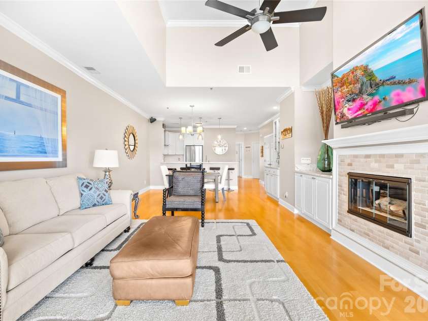 18700 Nautical Drive, Cornelius, NC 28031.  MLS# CAR4357308, YatesRealty ID 14763. Gorgeous updated top floor unit with gas fireplaces - all 3 TV's remain in the unit. 